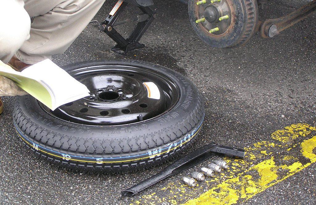 How to replace a flat tire?