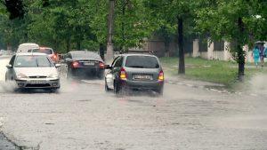 cars keep distance in rain