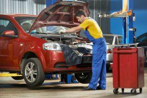 mechanic repairs car