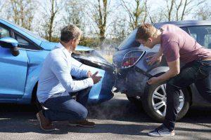 drivers argue at car accident