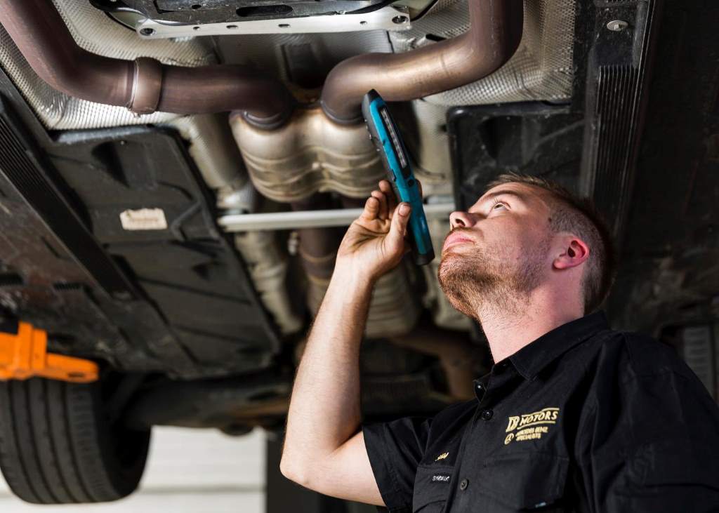 how to fix oil leaking into exhaust