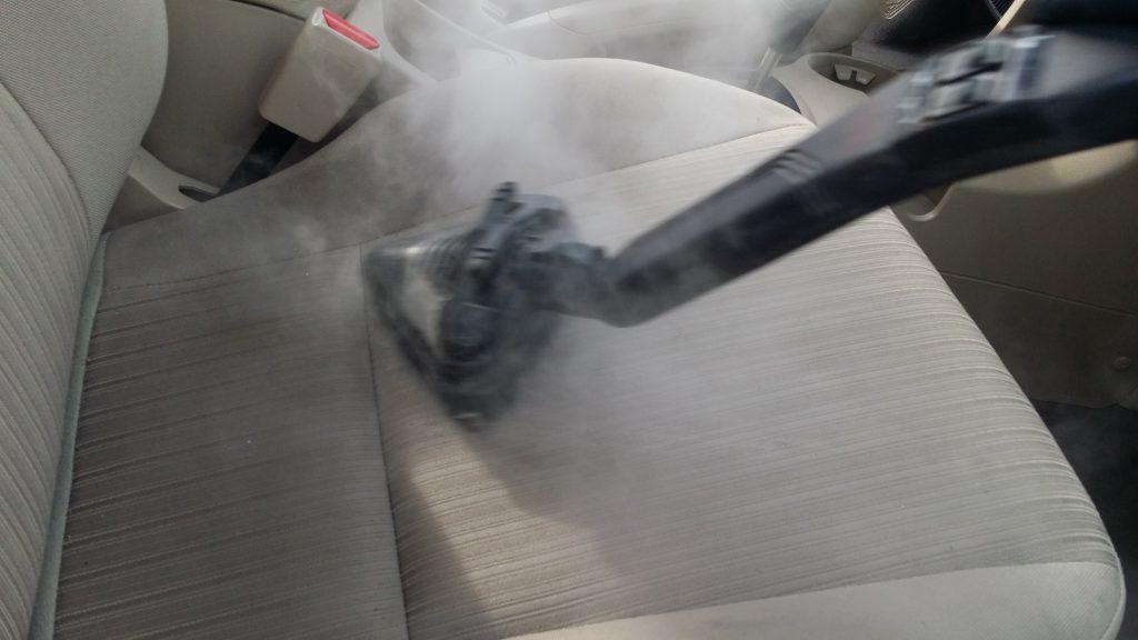 Steam cleaning a car