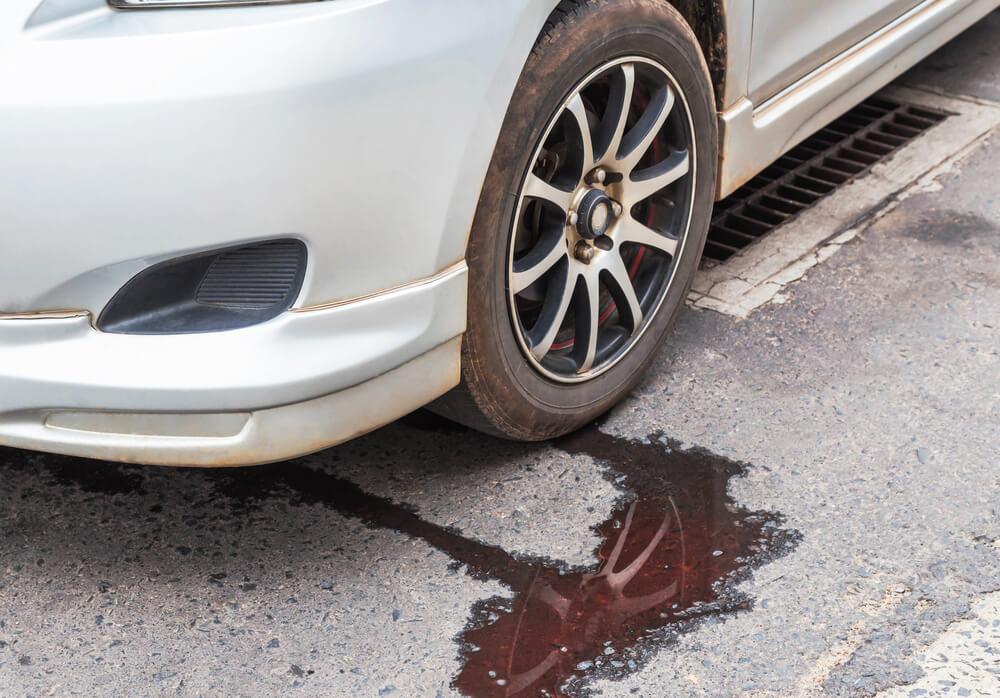 Is it Safe Driving with Red Fluid Leaking from Car?