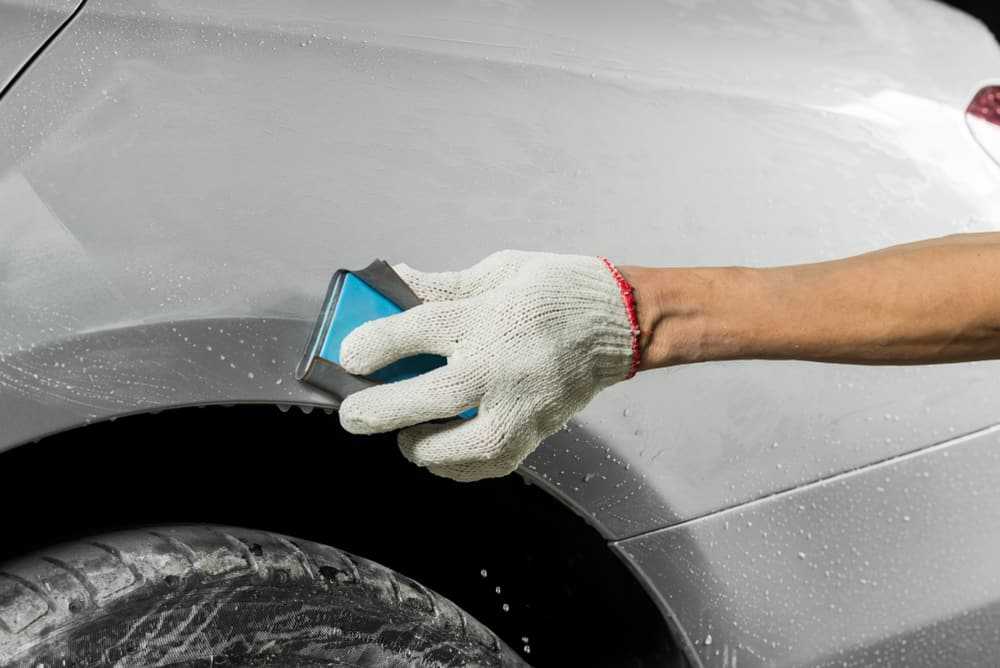 wetsanding a car,