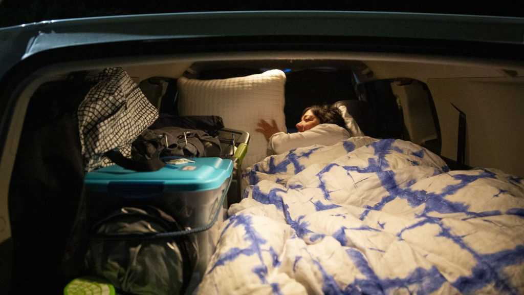 For a large car, it's easy for you to set the back seats into a bed. (Source: deseret)