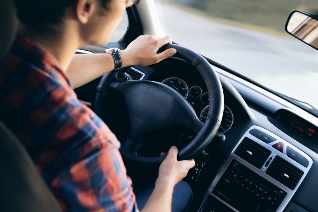 man in car