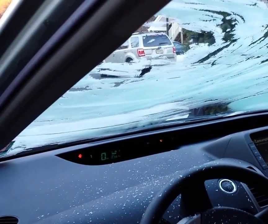 Why do some windshields frost up on the outside while others do