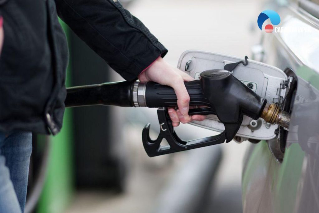 pumping gas with a car running