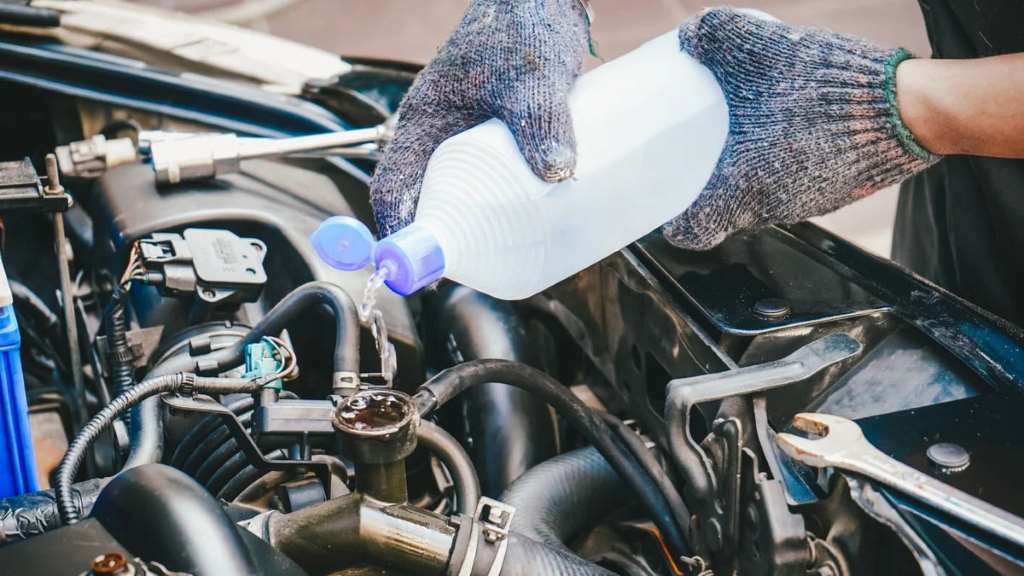 adding coolant to car